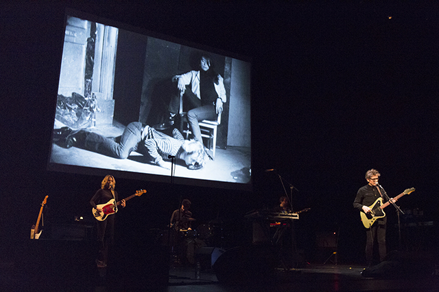 Dean Wareham performing to . Kiss the Boot (excerpt) (1966)     16mm film, black and white, silent, 4.5 minutes at 16fps; with Gerard Malanga, Mary Woronov (Photo by Rebecca Greenfield) 